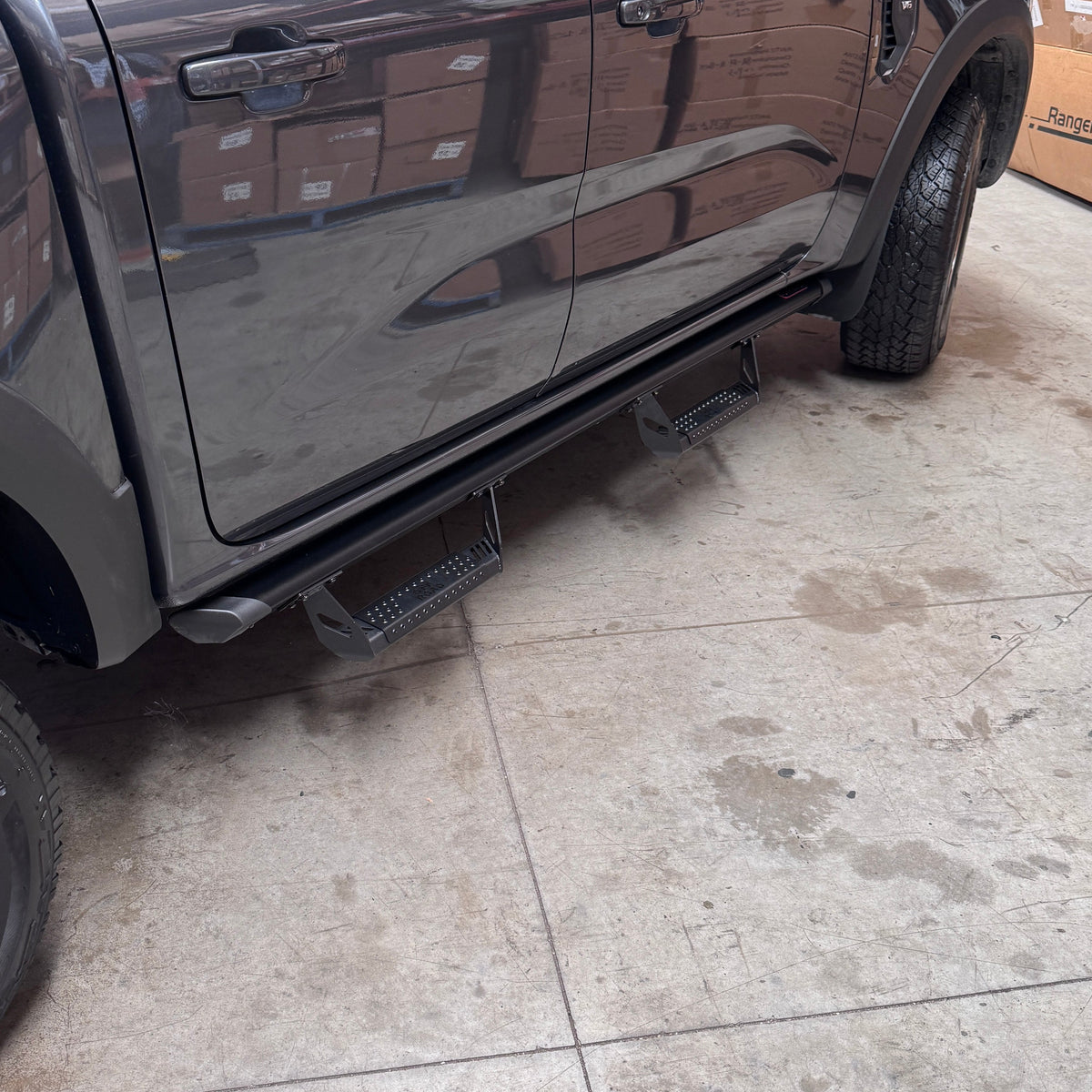 ANTZ Street Steps with military-style steps on a common rail mounted to a Next Gen Ford Ranger