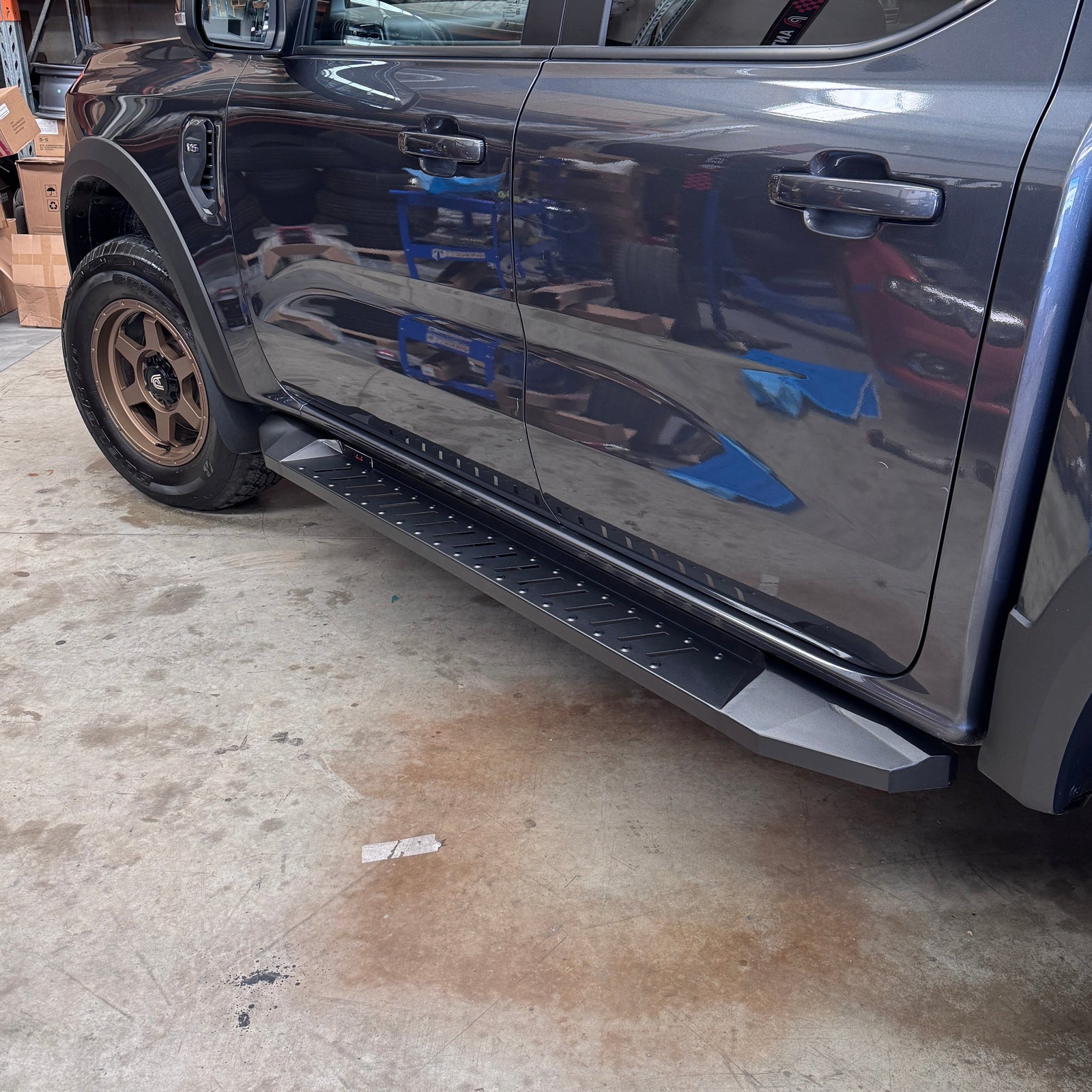 ANTZ pressed steel off-road running boards installed along the side of a Next Gen Ford Ranger