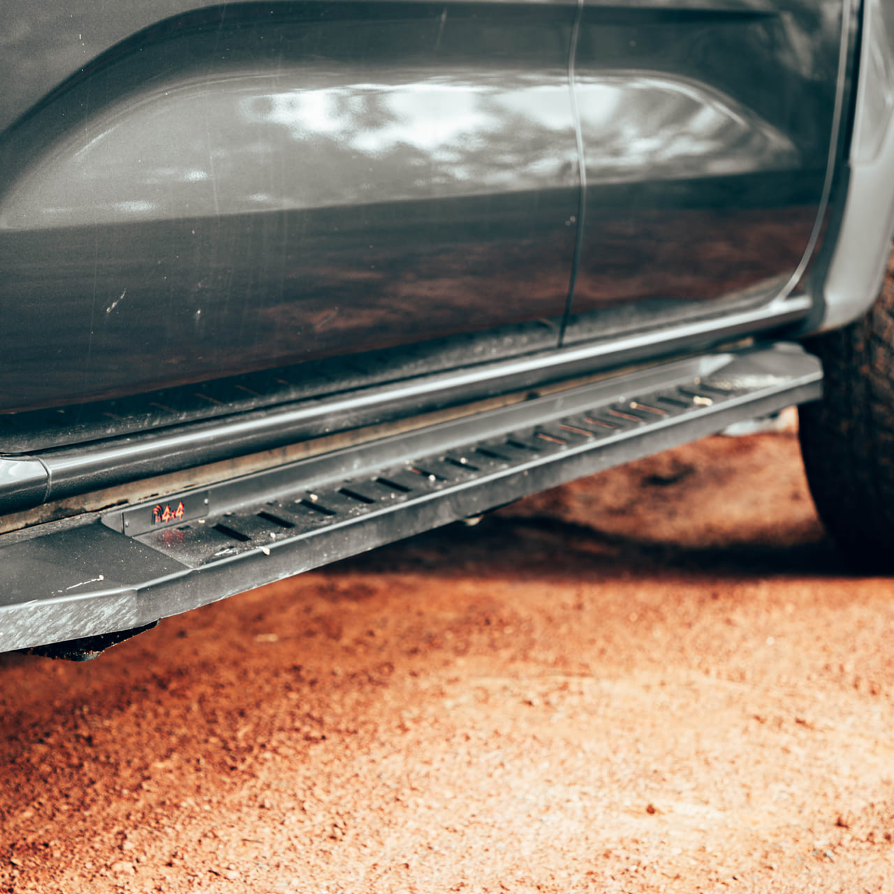 Pressed steel ANTZ off-road running board covered in mud on a Next Gen Ford Ranger